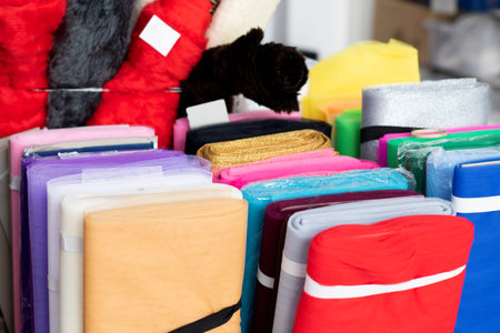 colorful textile on the stall in marketの写真素材