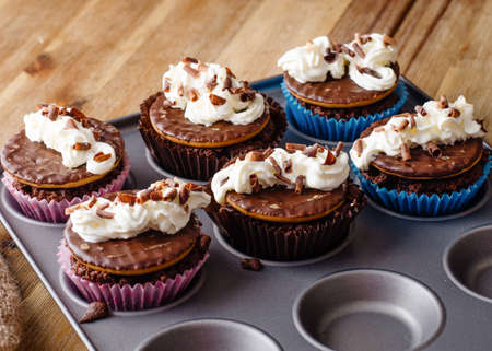 homemade chocolate cupcakes in cupcake mold on the table in the kitchenの写真素材