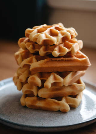 a few waffles on a plate in a cafeの写真素材