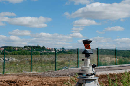 Prism installed above ordnance control point before beginning of the works on new construction siteの写真素材