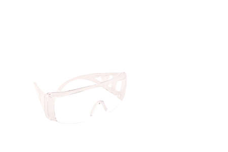 Impact-resistant safety goggles on white background. Protect your eyes conceptの写真素材