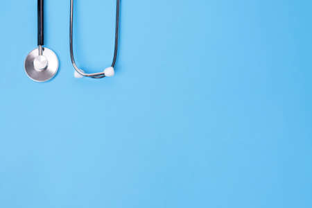 stethoscope  on blue background top view Space for text. see doctor.の写真素材