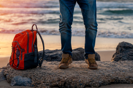 Bearded Man relaxing alone on the seaside on hot sunny day at sunset. Travel  Lifestyle conceptの写真素材