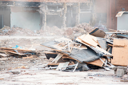 Demolition of building. Excavator breaks old house. Making space for the construction of a new housesの写真素材