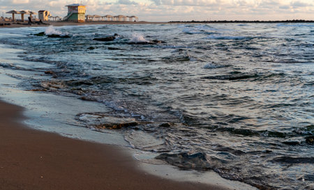 Amazing view of the city, sand beach, sea and cloudy blue skyの写真素材
