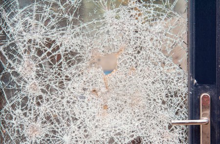 Broken window in new build houseの写真素材