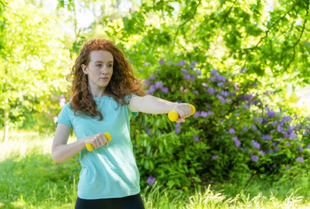 The happy person doing yoga and exercise in nature for mental health, wellness, and fitnessの写真素材