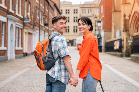 couple having a fun time in the city of England Enjoying travel conceptの写真素材