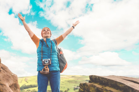 Happy woman tourist hiking and exploring new placesの写真素材