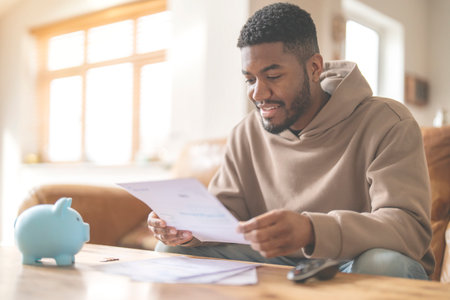 happy man reading letter response to his job application loan mortgage Happy smiling excitedの写真素材