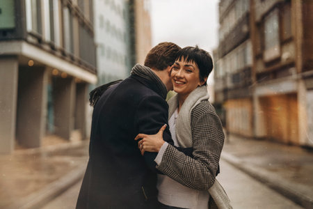 Happy couple walking on street smiling falling in loveの写真素材