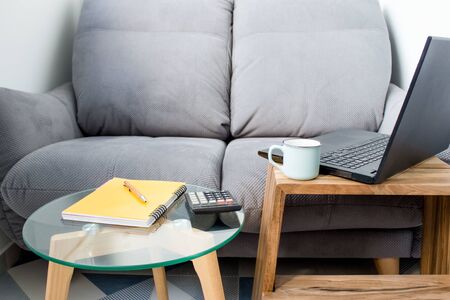 Home office of creative entrepreneur, workplace with black laptop, modern creative workspace with copy spaceの写真素材