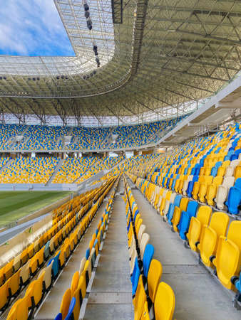 Lviv, Ukraine - March 1, 2020 : seats rows on Arena Lviv Stadium, soccer field stadium and stadium seats on a non sporting day, mobile photo, vertical compositionのeditorial素材