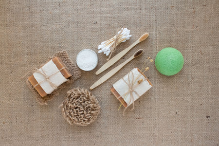 Flat lay composition with natural bathroom essentials, zero waste concept. Ecotools - toothbrushes,...