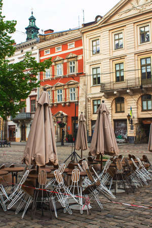 Lviv, Ukraine - May 17, 2020 : Grand Cafe Leopolis. Empty restaurant with open terrace in the city center. Reopening concept, coronavirus in Ukraine. Vertical compositionのeditorial素材