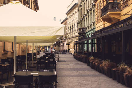 Lviv, Ukraine - May 17, 2020 : Empty restaurant with open terrace in the city center. Reopening concept, coronavirus in Ukraineのeditorial素材