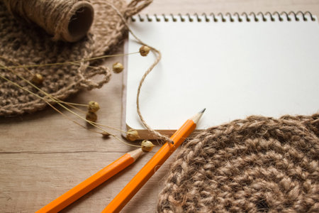 Creative composition with natural jute twine roll - linen or cannabis and jute washclothes on wooden...
