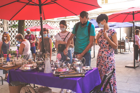 Lviv, Ukraine - August 09, 2020 : summer garage sale in town hall, Tlum and Kram. People wearing...