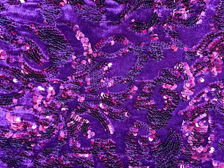 Purple sequined fabric texture - shiny pink and purple sparkling sequins background. Festive,...