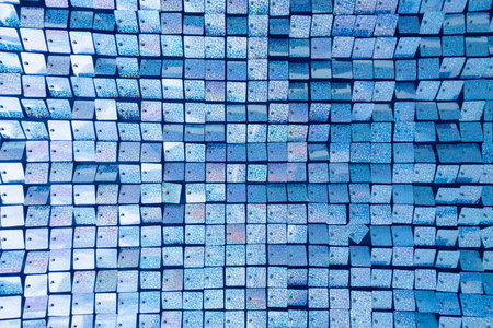Square blue fabric texture - shiny green sparkling sequins background. Festive, carnival or fashion...