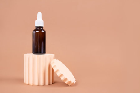Mockup dropper bottle of natural organic cosmetics - hyaluronic acid, serum, moisturizer or facial nourishing anti-aging oil. Essential oil in trendy neutral still life composition, modern apothecaryの写真素材