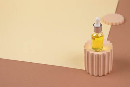 Dropper bottle - natural organic cosmetics, hyaluronic acid, serum, moisturizer or facial anti-aging oil. Essential oil in trendy biege still life composition. Modern apothecary, mockup imageの写真素材