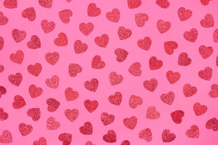 Bright festive background with pink glitter hearts - St. Valentine's Day celebration concept. Love...