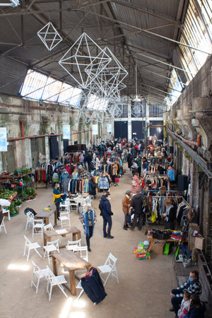 Lviv, Ukraine - March 7, 2021 : people shopping on garage sale in Lem Station, Tlum and Kram. Hipster vintage clothes and other secondhand goods on flea market. Thrift shopping or donation conceptのeditorial素材