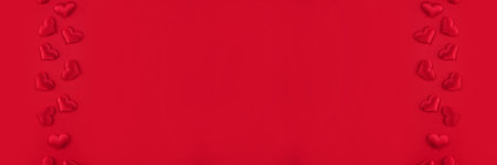 Festive St. Valentines banner with red hearts on red background with copy space. St.Valentines day...