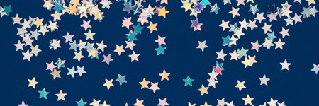 Abstract festive background with holographic sparkling stars confetti on dark blue background....