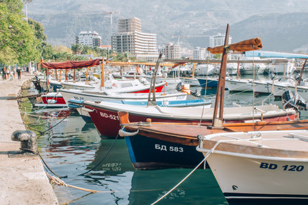 Budva, Montenegro - September 2021 : tourist season in marina Budva, various fishing and taxi boats...