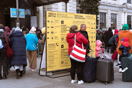 Lviv, Ukraine - March 8, 2022 : Ukrainian refugees at Lviv railway station looking for temporary...