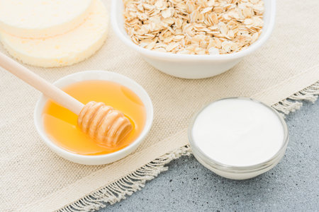 Making face mask at home with natural ingredients - herbal honey, greek yogurt and oatmeal. Natural skin care and beauty treatment. Zero waste handmade cosmeticsの写真素材