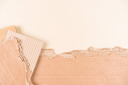 Many sheets of corrugated cardboard over light brown background as eco background with copy space for ecological project or paper packaging industry. Selective focusの写真素材