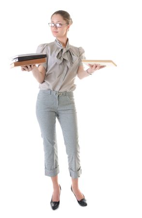Beauty standing woman in glasses with books on both hands on white backgroundの写真素材