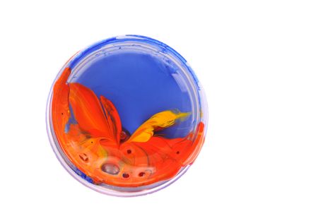 Mixed red and yellow colors in tan with blue paint isolated on white backgroundの写真素材