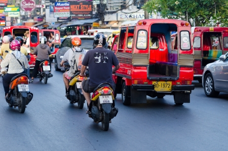 Patong, Phuket, Thailand - January 16, 2012: Intensive traffic on Patong street with taxi, motorbikes, cars in high tourist seasonのeditorial素材