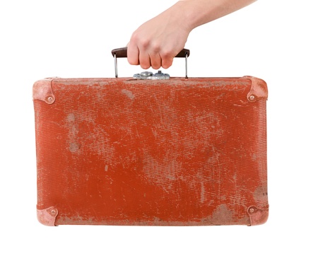 Vintage red suitcase in male hand isolated over white background の写真素材