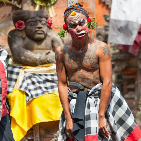 BALI - SEP 21: Clown Barong and Kris Dance performs at Sahadewah, in Batubulan, Bali, Indonesia on Sep 21, 2012. This famous play represents an fight between good and bad gods.のeditorial素材