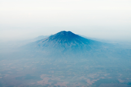 Volcano top under sky with foggy valley, bird's eye view. Java island, Indonesiaの写真素材