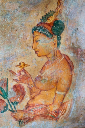 Ancient wall paintings of cloudy maiden with flower. One of the 5th century frescoes at the ancient rock fortress of Sigiriya, Sri Lanka. のeditorial素材