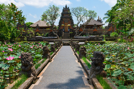 Balinese temple Pura Saraswati in Ubud with lotus flowers in ponds in frontの写真素材