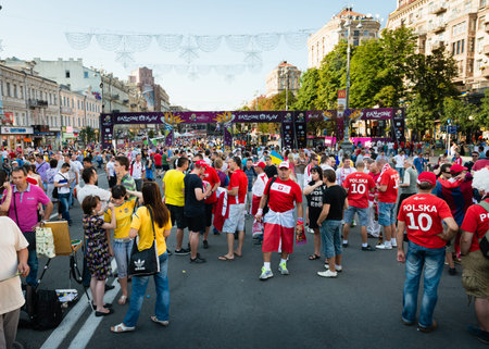KIEV, UKRAINE - JUL 1: Football fans walk on the central fun zone before EURO 2012 final match Spain vs. Italy on July 1, 2012 in Kiev, Ukraineのeditorial素材