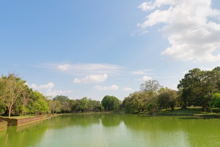 Gigantic pond in tropical forest under blue sky.の写真素材