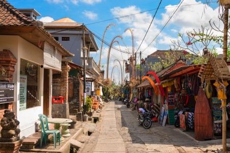 BALI, INDONESIA - SEP 19: Tourist street decorated by traditional penjor with shops and tours on Sep 19, 2012 in Ubud, Bali, Indonesia. Ubud is popular tourist attraction. のeditorial素材