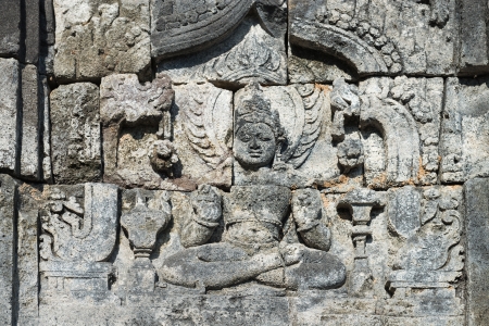 Images of Buddha on wall of temple in Candi Sewu complex (8th Century). Candi Sewu means 1000 temples, which links it to the legend of Loro Djonggrang. In fact this complex has 253 building structures and it is the second largest Buddhist temple in Java, のeditorial素材