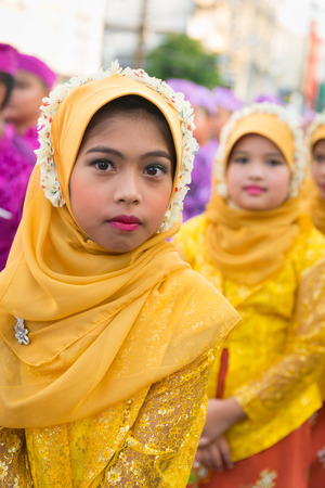PHUKET, THAILAND - 07 FEB 2014: Children in muslim headscarf take part in procession parade of annual old Phuket town festival. のeditorial素材