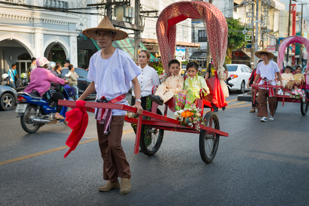 PHUKET, THAILAND - 07 FEB 2014: Rickshas with passenger  take part in procession parade of annual old Phuket town festival. のeditorial素材