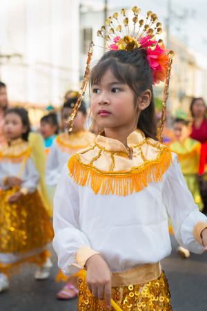PHUKET, THAILAND - 07 FEB 2014: Young girl take part in procession parade of annual old Phuket town festival. のeditorial素材