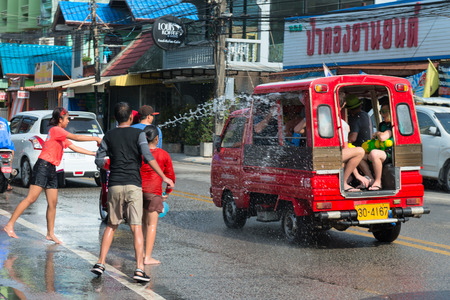 Phuket, Thailand - April 13, 2014: Tourist and residents celebrate Songkran Festival, the Thai New Year by splashing water to each others on Patong streets. のeditorial素材